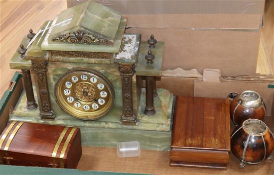 A French onyx mantel clock, two cigarette boxes and two nutshell vases